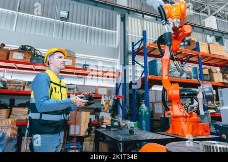 Programming robot controller, Programming robotic arms in factory ...