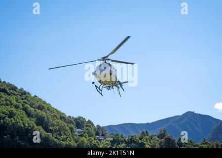 Switzerland, Agno-Lugano Airport, Helicopter on take off Stock Photo