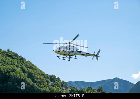 Switzerland, Agno-Lugano Airport, Helicopter on take off Stock Photo