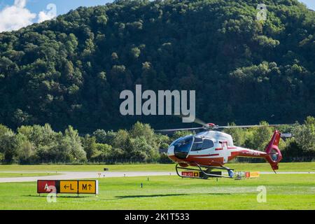 Switzerland, Agno-Lugano Airport, Helicopter on take off Stock Photo