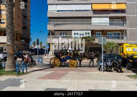 Tourists enjoying views by carriage in Malaga, Spain on September 4, 2022 Stock Photo
