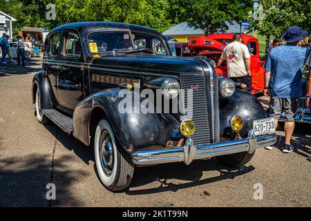 Falcon Heights, MN - June 18, 2022: High perspective front corner view of a 1937 Buick Series 40 Special Sedan at a local car show. Stock Photo