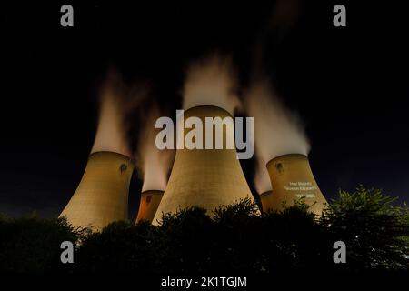 An outline of HRH Queen Elizabeth's head was projected onto one of the cooling towers of Drax Power Station to pay tribute after her death. Stock Photo