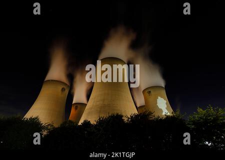 An outline of HRH Queen Elizabeth's head was projected onto one of the cooling towers of Drax Power Station to pay tribute after her death. Stock Photo