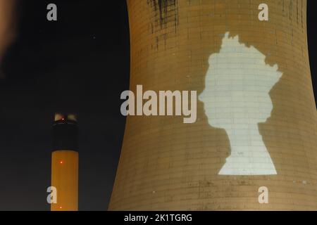 An outline of HRH Queen Elizabeth's head was projected onto one of the cooling towers of Drax Power Station to pay tribute after her death. Stock Photo