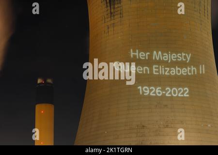 An outline of HRH Queen Elizabeth's head was projected onto one of the cooling towers of Drax Power Station to pay tribute after her death. Stock Photo