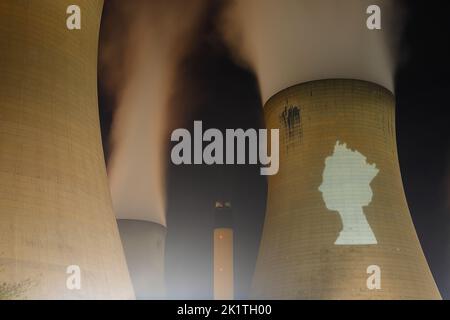 An outline of HRH Queen Elizabeth's head was projected onto one of the cooling towers of Drax Power Station to pay tribute after her death. Stock Photo