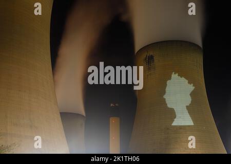 An outline of HRH Queen Elizabeth's head was projected onto one of the cooling towers of Drax Power Station to pay tribute after her death. Stock Photo