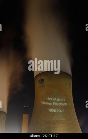 An outline of HRH Queen Elizabeth's head was projected onto one of the cooling towers of Drax Power Station to pay tribute after her death. Stock Photo