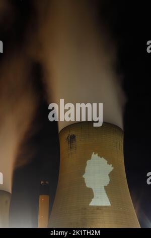 An outline of HRH Queen Elizabeth's head was projected onto one of the cooling towers of Drax Power Station to pay tribute after her death. Stock Photo