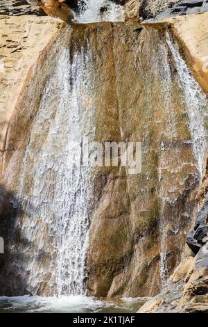 Vertical shot of a waterfall during daytime Stock Photo - Alamy