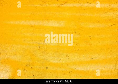 yellow painted plaster wall texture Stock Photo