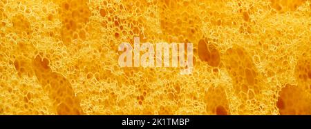 banner of macro yellow polyurethane foam rubber washcloth sponge Stock Photo