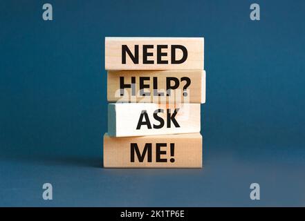 Support and need help ask me symbol. Concept words Need help ask me on wooden blocks on a beautiful grey table grey background. Business, support and Stock Photo