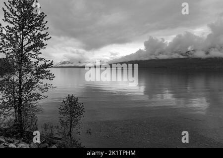 Black & white view of stormy skies over Lake McDonald; Glacier National Park; Montana; USA Stock Photo