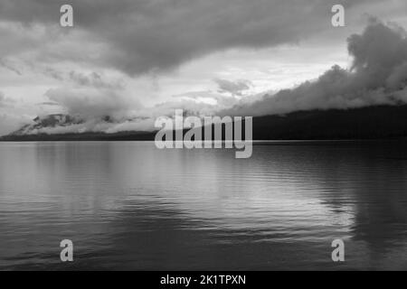 Black & white view of stormy skies over Lake McDonald; Glacier National Park; Montana; USA Stock Photo