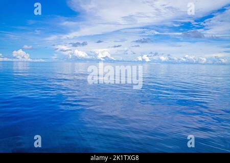 A glassy flat day on the ocean off the island of Yap, Micronesia. Stock Photo