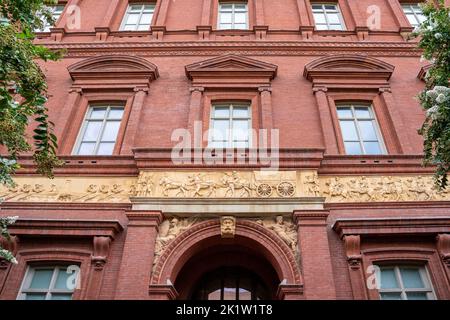 Exterior view of the National Building Museum, originally the Pension Building built in 1887, showing a frieze sculpted by Caspar Buberi depicting Civ Stock Photo