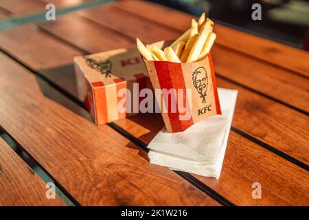 Krakow, Poland - September 11 2022: KFC fast food Fried Chicken (also known as Kentucky Fried Chicken) small box ready to serve to customer, KFC is a Stock Photo