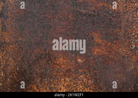 Dark light red rusty metal plate. Grunge texture. Rusty metal background. Rusty orange texture. Rust. Stock Photo