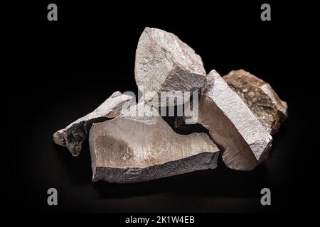 steel ore, produced from iron ore, isolated black background Stock Photo