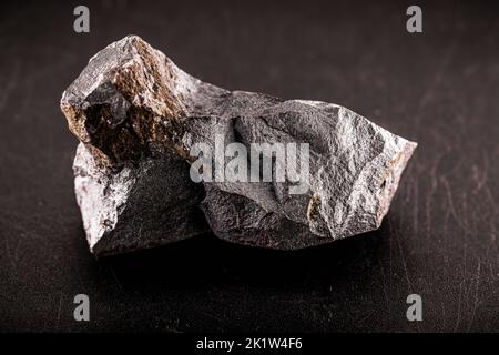 steel ore, produced from iron ore, isolated black background Stock Photo