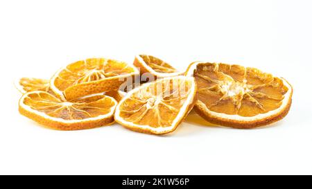 Dried orange slices. Group of dried orange slices isolated on white background. Selective focus. Stock Photo