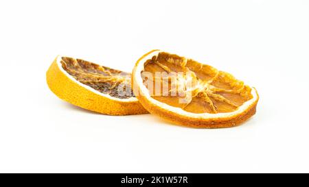 Dried orange slices. Group of dried orange slices isolated on white background. Selective focus. Stock Photo