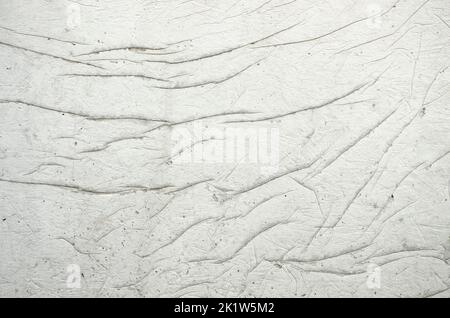 Cracked concrete. Concrete texture with cracks. Gray asphalt. The old texture is broken. Concrete sags with cracks from poor-quality plaster Stock Photo