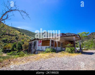 Old Abandoned Store Front Building In Arizona Foothills Stock Photo