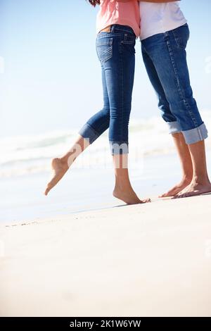 Lets spend the rest of our lives in love. a couple standing close to the waters edge on a warm summers day. Stock Photo