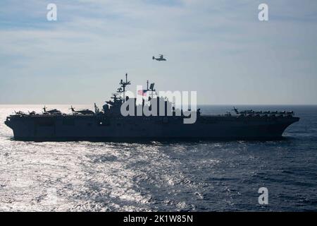 EAST CHINA SEA (Sept. 17, 2022) The amphibious assault carrier USS Tripoli (LHA 7) sails alongside the forward-deployed amphibious assault carrier USS America (LHA 6) in the East China Sea, Sept. 17, 2022. America, lead ship of the America Amphibious Ready Group, is operating in the 7th Fleet area of operations to enhance interoperability with allies and partners and serve as a ready-response force to defend peace and stability in the Indo-Pacific region. (U.S. Navy photo by Mass Communication Specialist 3rd Class Amy Mullins)