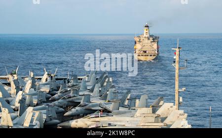 220920-N-BR419-1012 PHILIPPINE SEA (Sept. 20, 2022) The U.S. Navy’s only forward-deployed aircraft carrier, USS Ronald Reagan (CVN 76), prepares to come alongside the Military Sealift Command fleet replenishment oiler, USNS Rappahannock (T-AO 204), for a fueling-at-sea in the Philippine Sea, Sept. 20. Fueling-at-sea increases the capability of the U.S. Navy’s carrier force, allowing ships to stay at sea indefinitely by providing aviation fuel anywhere in the world. Ronald Reagan, the flagship of Carrier Strike Group 5, provides a combat-ready force that protects and defends the United States, Stock Photo