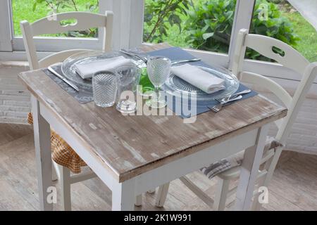 lunch set table in a bay window Stock Photo
