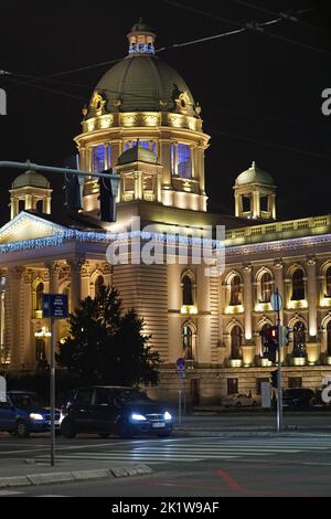Belgrade, Serbia - January 16, 2016: Serbian Parliament Government building at winter night with holiday lights on decor. Stock Photo