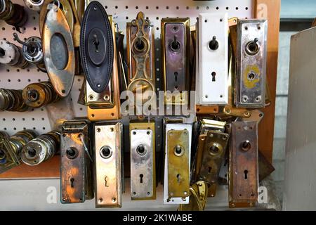Collection of old used door knob plates Stock Photo