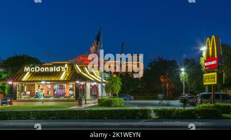 A McDonald's fast food restaurant at night in Fort Lauderdale, Florida, USA. Stock Photo