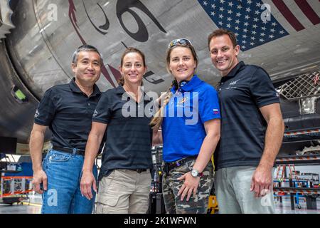 The crew members who will fly on NASAs SpaceX Crew-5 mission to the International Space Station pause for a photograph during a visit to the agencys Kennedy Space Center in Florida on May 10, 2022. From left are JAXA (Japan Aerospace Exploration Agency) astronaut Koichi Wakata, mission specialist; NASA astronaut Nicole Mann, mission commander; Roscosmos cosmonaut Anna Kikina, mission specialist; and NASA astronaut Josh Cassada, pilot. SpaceXs Falcon 9 rocket and Crew Dragon spacecraft are scheduled to lift off from Kennedys Launch Complex 39A on Oct. 3, 2022. This will be the fifth crew ro Stock Photo