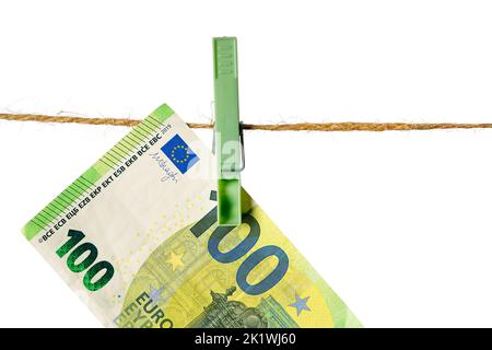 Euro banknotes hanging on a clothesline against white background. Money laundering concept Stock Photo
