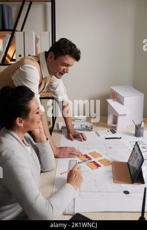 Architects having online meeting with investors and discussing construction plan details Stock Photo
