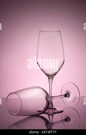 Two elegant empty wine glasses, reflection contour minimalistic still life on background. Stock Photo