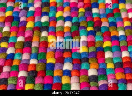 Lots of colorful felt balls side by side Stock Photo