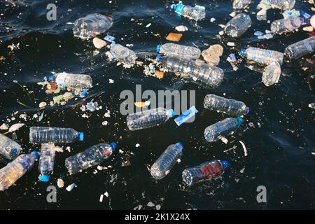 Plastic bottles in the sea. Garbage and pollution. Environmental issues Stock Photo