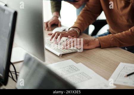 Closeup image of junior software developer programming under control team leader Stock Photo