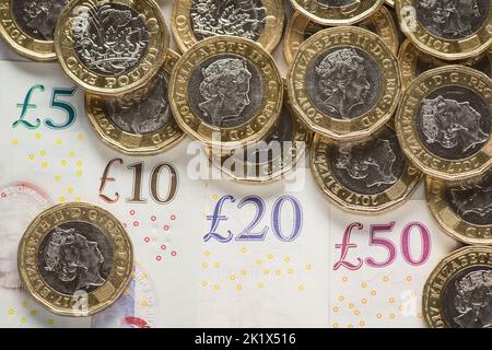 File photo dated 26/01/18 of a UK five pound, ten pound, twenty pound and fifty pound notes with one pound coins. Government borrowing hit £11.8 billion in August as interest payments surged higher due to soaring inflation. The Office for National Statistics (ONS) said that borrowing in August was £2.6 billion below levels from the same month last year, but represented a £6.5 billion surge from pre-pandemic levels in 2019, when it stood at £5.3 billion. Issue date: Wednesday September 21, 2022. Stock Photo