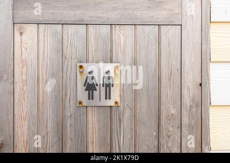 male and female symbol on a rustic wooden background Stock Photo