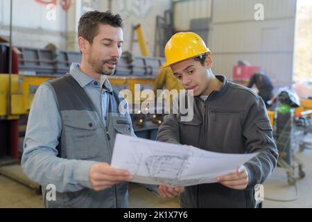 engineers working on project in metallurgy workshop Stock Photo