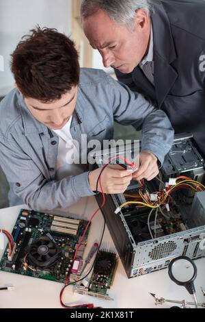 two it specialists working in the office Stock Photo