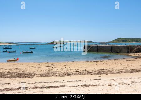 Looking across Tresco Flats from the quay at New Grimsby, Tresco, towards Bryher and Samson, with St. Mary's in the far distance: Isles of Scilly, UK Stock Photo