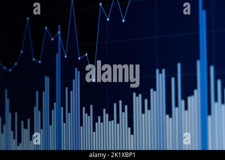 Line chart and bar chart. Close up of a blue chart on a dark background on a led display. Stock Photo